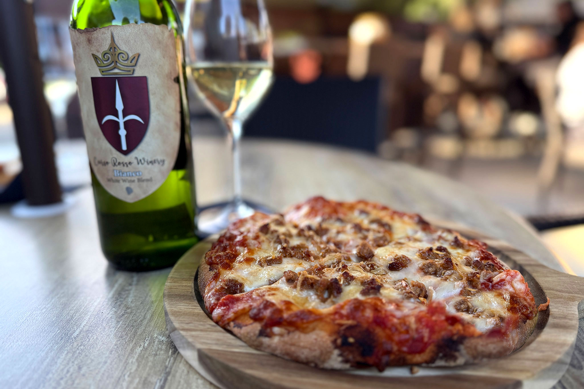 Pizza and Wine and on Carso Rosso Winery's patio